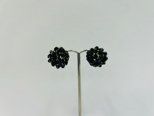 Black and gold tone stud earrings