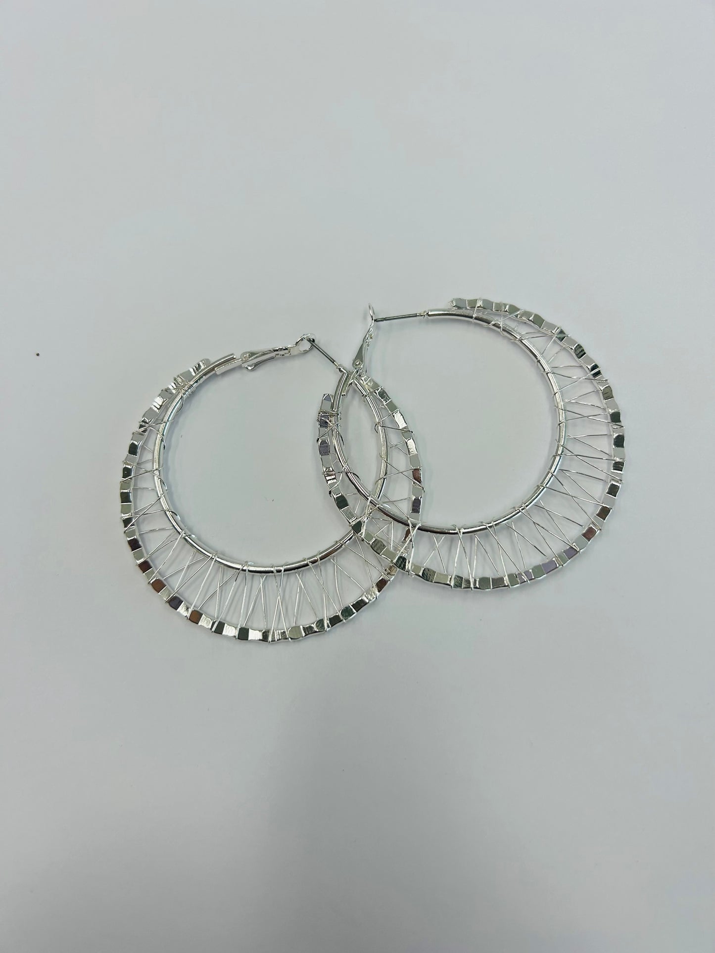 Silver tone hoop earrings